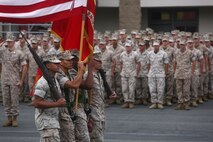A color guard from 1st Light Armored Reconnaissance Battalion, 1st Marine Division, marches with the national and organizational colors during the battalion’s 30th anniversary rededication ceremony, aboard Marine Corps Base Camp Pendleton, Calif., July 1, 2015. After the ceremony, the Marines and Sailors of the battalion hiked to a nearby beach and held the annual Highlander Games Warrior Night. (U.S. Marine Corps photo by Staff Sgt. Bobbie A. Curtis)