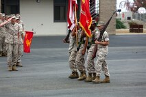 A company commander assigned to 1st Light Armored Reconnaissance Battalion, 1st Marine Division, salutes the national and organizational colors during the battalion’s 30th anniversary rededication ceremony aboard Marine Corps Base Camp Pendleton, Calif., July 1, 2015. After the ceremony, the Marines and Sailors of the battalion hiked to a nearby beach and held the annual Highlander Games Warrior Night. (U.S. Marine Corps photo by Staff Sgt. Bobbie A. Curtis)