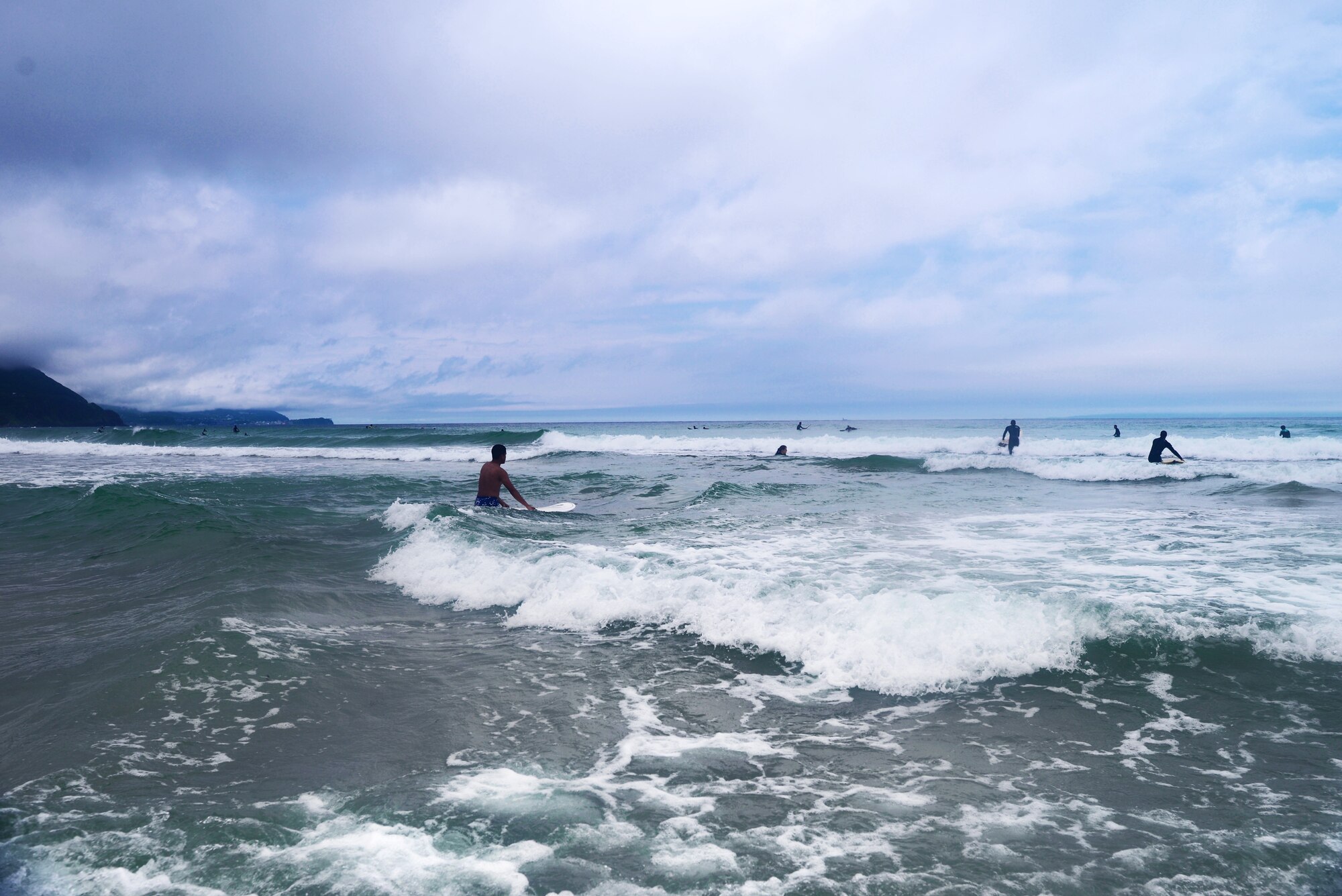 Airmen from Yokota Air Base surf the waves of Tadato Beach in Shimoda, Japan, June 27, 2015. As part of the Yokota’s Single Airman Program, Airmen had the opportunity to learn to surf and learn skills to better relate to others. (U.S. Air Force photo by Airman 1st Class Delano Scott/Released)
