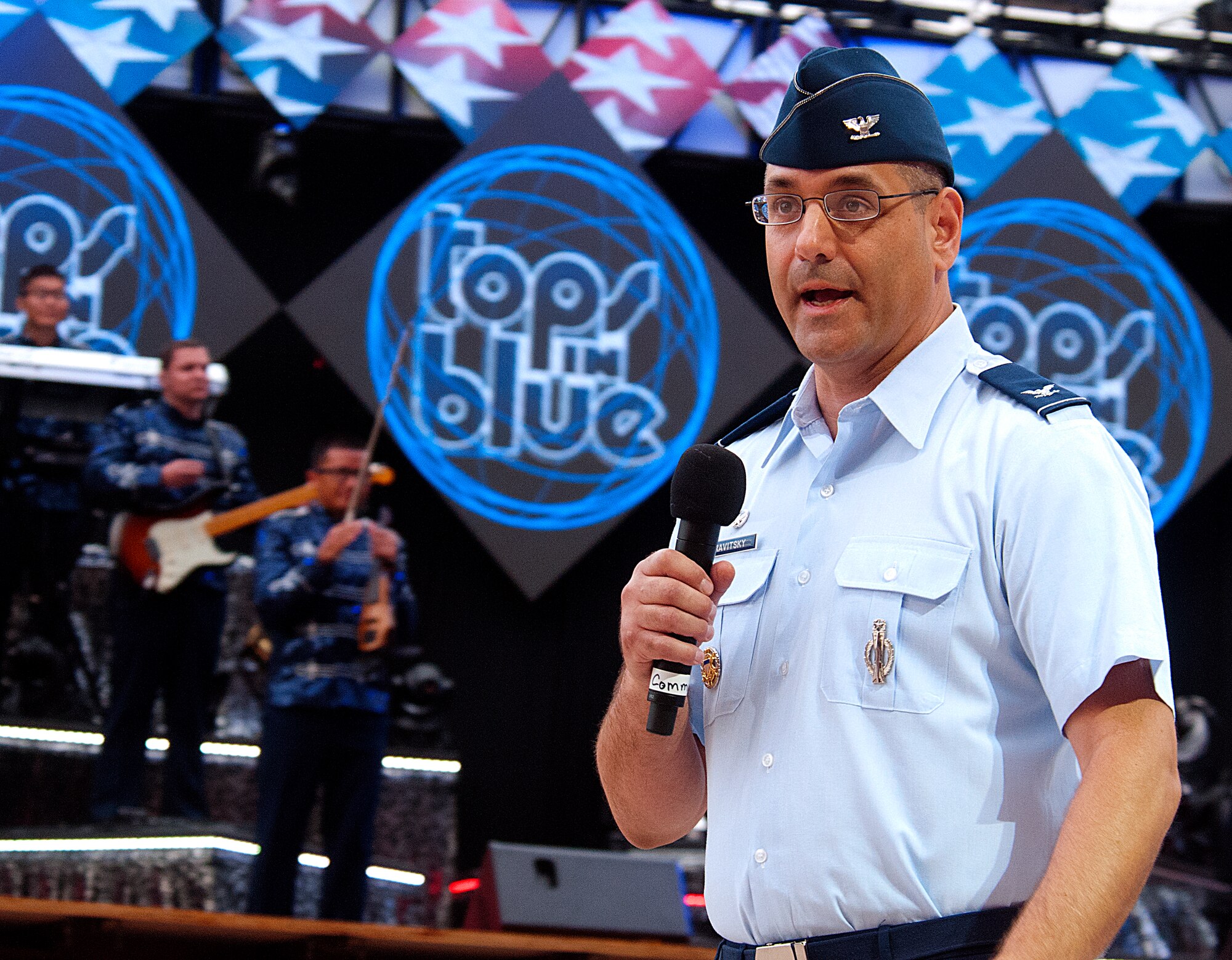 Col. Stephen Kravitsky, 90th Missile Wing commander, speaks a few opening words before the Tops in Blue performance at Frontier Park, Cheyenne, Wyo., July 4, 2015. The 90th MW operates out of F.E. Warren Air Force Base, Wyo., Cheyenne’s neighbor. (U.S. Air Force photo by Senior Airman Jason Wiese)