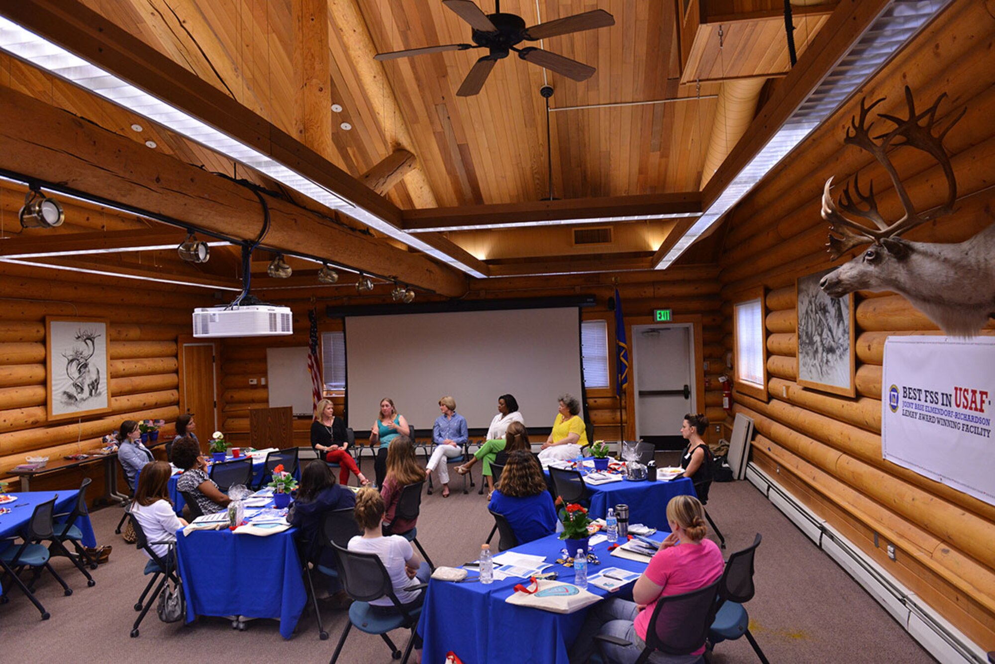 Experienced military spouses share stories and advice with spouses new to Joint Base Elmendorf-Richardson June 25 as part of the quarterly Joint Spouse Orientation held at the Military Family Readiness Center. The orientation is designed to equip spouses who may be new to the military, joint environments or Alaska with the tools and information they need to succeed. (U.S. Air Force Photo by Airman 1st Class Kyle Johnson)