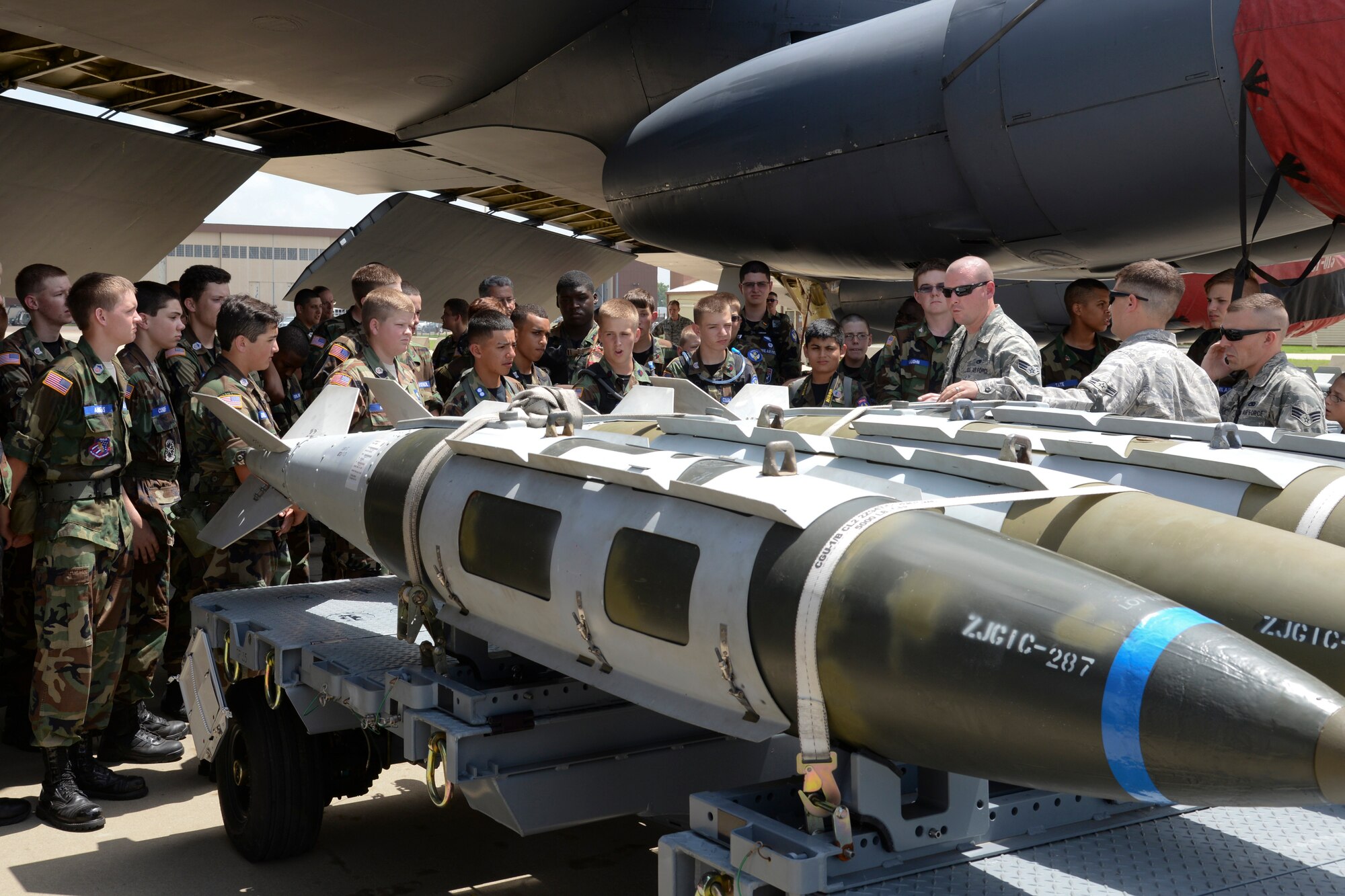 Civil Air Patrol cadets learn about munitions during a B-52 Stratofortress static display tour at Barksdale Air Force Base, La., June 30,2015. The CAP Arkansas/Louisiana Joint Wing Encampment was a 10-day course from June 25 – July 5, designed to give young cadets the opportunity to experience Air Force customs and various military careers. (U.S. Air Force photo/ Senior Airman Jannelle Dickey)