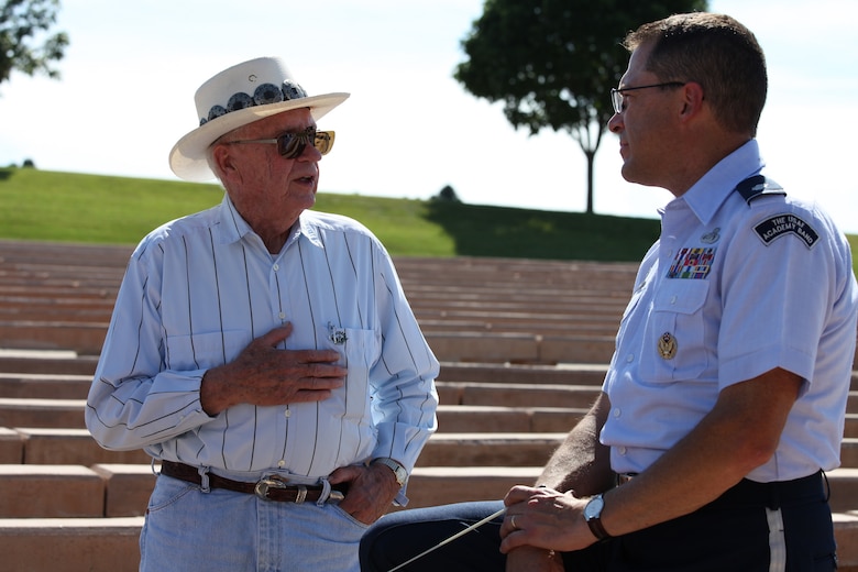 Lt. Col. Dan Price, commander and conductor of the U.S. Air Force Academy band, chats with Heinz Hilpmann, an Army WWII and Korean War vet, after the band's performance at Five Rocks Amphitheatre in Gering, Nebraska June 28, 2015. (U.S. Air Force photo/2nd Lt. Darren Domingo)