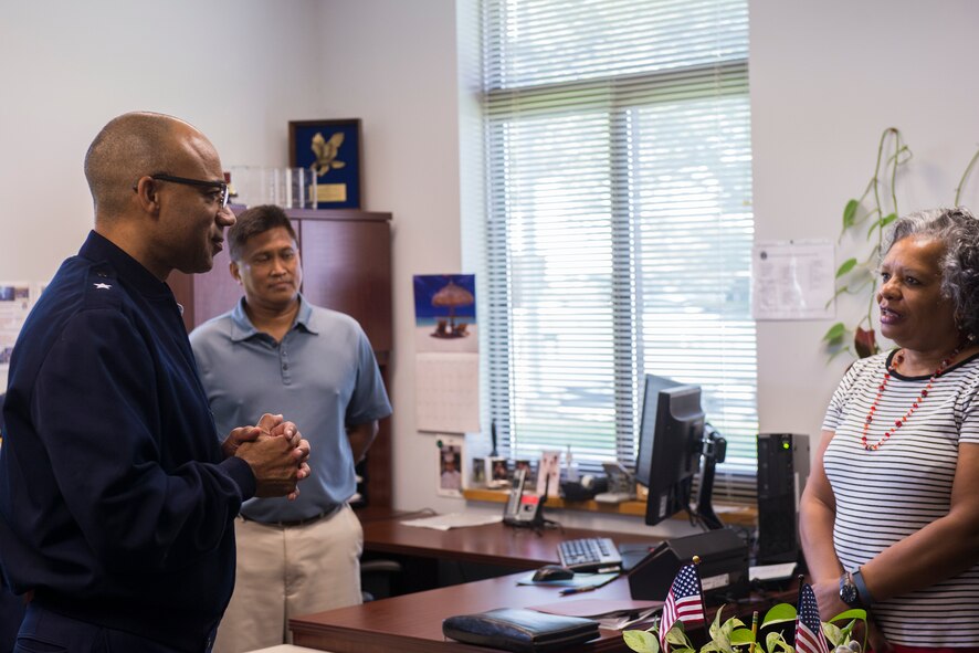 U.S. Air Force Brig. Gen. James Johnson, left, Air Force Recruiting Service commander, addresses the concerns of Leila Brown, 336th Recruiting Squadron recruiter support manager, during his visit, July 7, 2015, at Moody Air Force Base, Ga. While at Moody, Johnson offered solutions to the challenges the 336th RCS Airmen face and gave insight to the future of the career field. (U.S. Air Force photo by Airman 1st Class Ceaira Tinsley/Released)