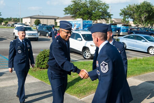 U.S. Air Force Brig. Gen. James Johnson, Air Force Recruiting Service commander, greets Airmen from the 336th Recruiting Squadron during his visit July 7, 2015, at Moody Air Force Base, Ga. Johnson commands approximately 2,600 Airmen and civilians and is responsible for more than 1,200 recruiting offices. While visiting Moody, Johnson toured the 336th RCS, hosted an office-call and coined four Airmen for their hard work despite the obstacles recruiting Airmen face. (U.S. Air Force photo by Airman 1st Class Ceaira Tinsley/Released)