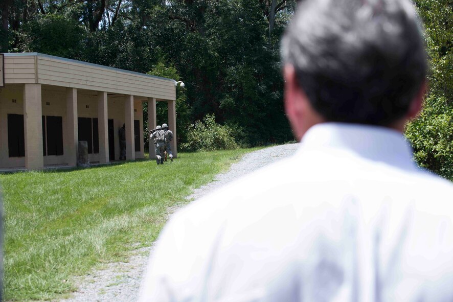 U.S. Rep. Buddy Carter of Georgia, views an 820th Base Defense Group military operations in urban terrain demonstration during a base tour July 2, 2015, at Moody Air Force Base, Ga. Carter spoke to Airmen from the 820th BDG about their mission and responsibilities following the demonstration. (U.S. Air Force photo by Airman 1st Class Dillian Bamman/Released)