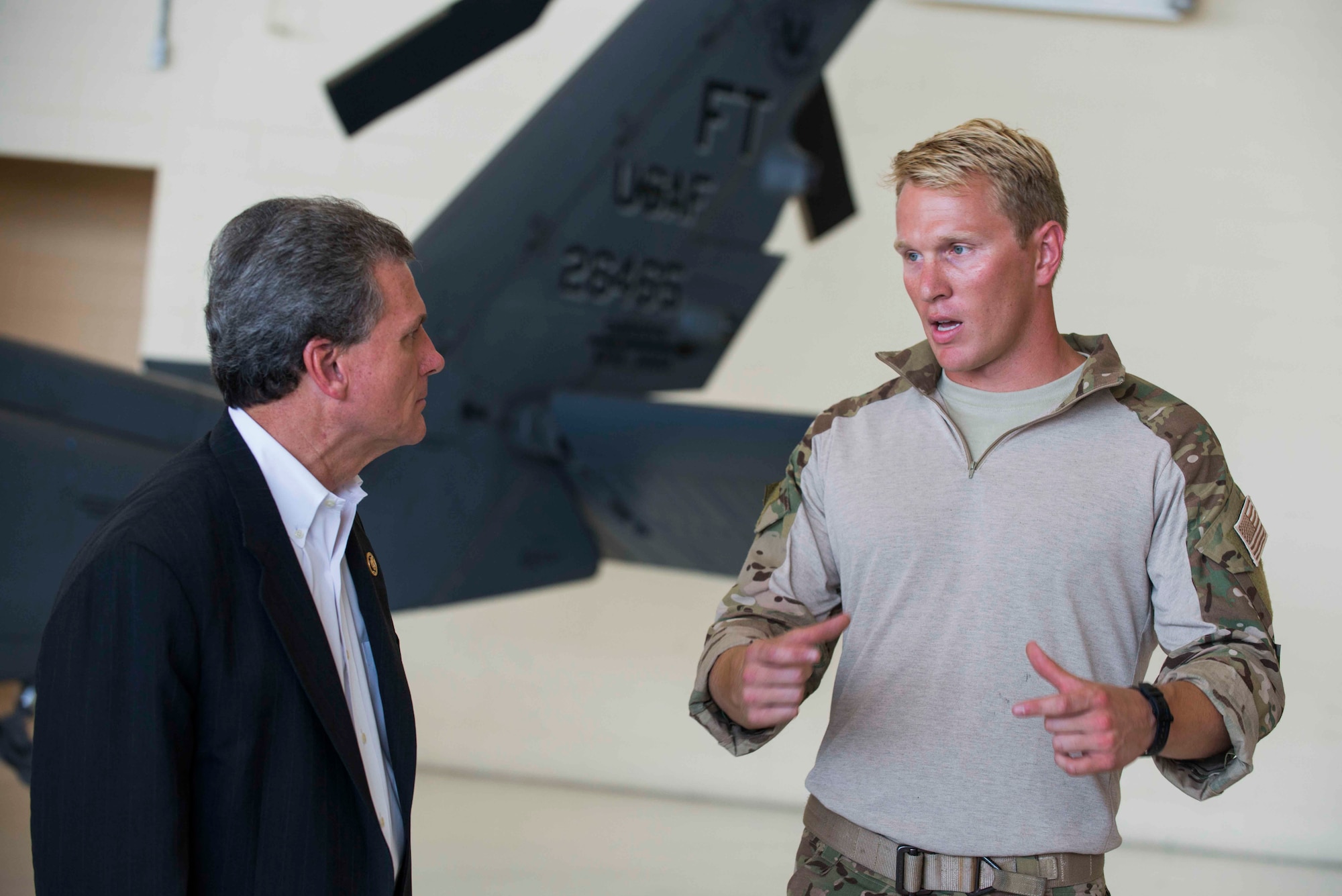 U.S. Air Force Capt. Christopher Goetz, right, 38th Rescue Squadron combat rescue officer, speaks with U.S. Rep. Buddy Carter of Georgia, during a base tour, July 2, 2015, at Moody Air Force Base, Ga. Goetz spoke about the way CROs and pararescuemen work together to accomplish search and rescue missions. (U.S. Air Force photo by Airman 1st Class Dillian Bamman/Released)