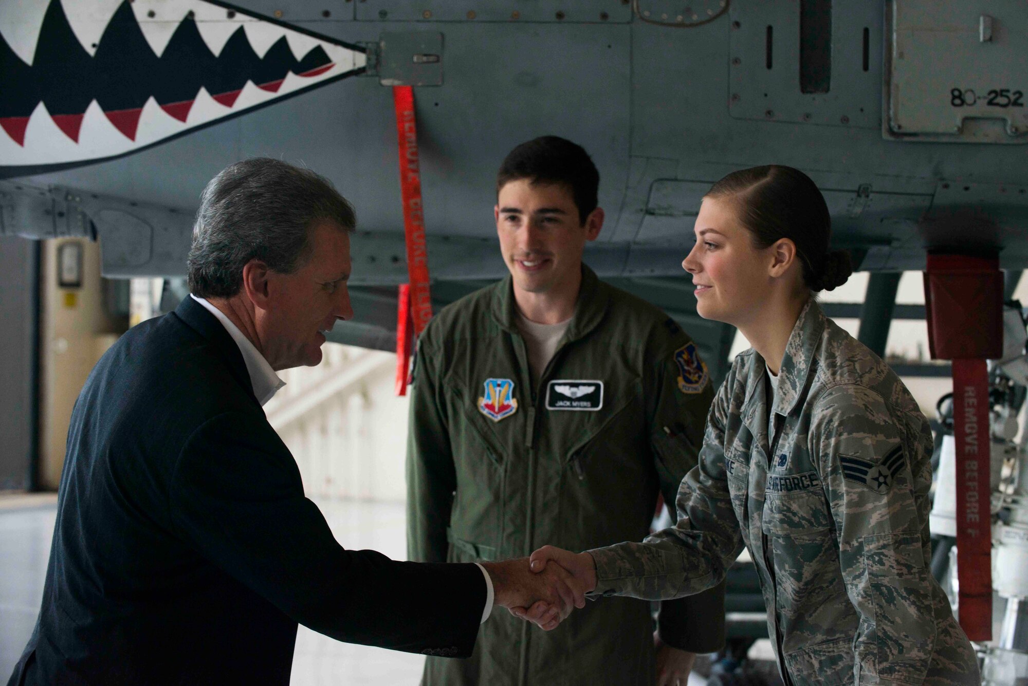 U.S. Rep. Buddy Carter of Georgia, left, shakes hands with U.S. Air Force Senior Airman Robin Burke, right, 23d Aircraft Maintenance Squadron dedicated crew chief, and Capt. Jake Myers, 74th Fighter Squadron A-10C Thunderbolt II pilot, during a base tour July 2, 2015, at Moody Air Force Base, Ga. This is Carter’s first official visit to Moody. (U.S. Air Force photo by Airman 1st Class Dillian Bamman/Released)