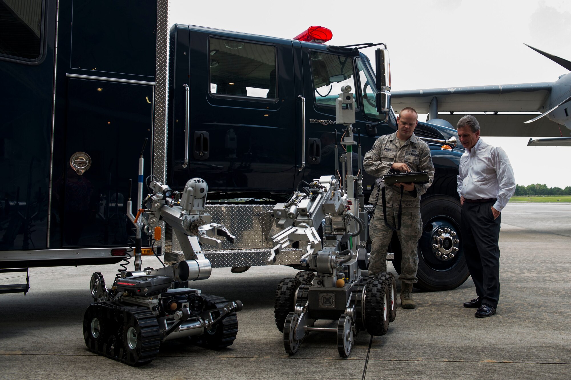 U.S. Air Force Staff Sgt. Ryan Prince, 23d Civil Engineer Squadron explosive ordnance disposal specialist, showcases the F-6A EOD robot to U.S. Rep. Buddy Carter of Georgia, during a base tour July 2, 2015, at Moody Air Force Base, Ga. Carter spoke with Airmen from the 347th Rescue Group, the 23d Security Forces Squadron, the 23d Medical Group and the 23d CES about their missions. (U.S. Air Force photo by Airman 1st Class Dillian Bamman/Released)