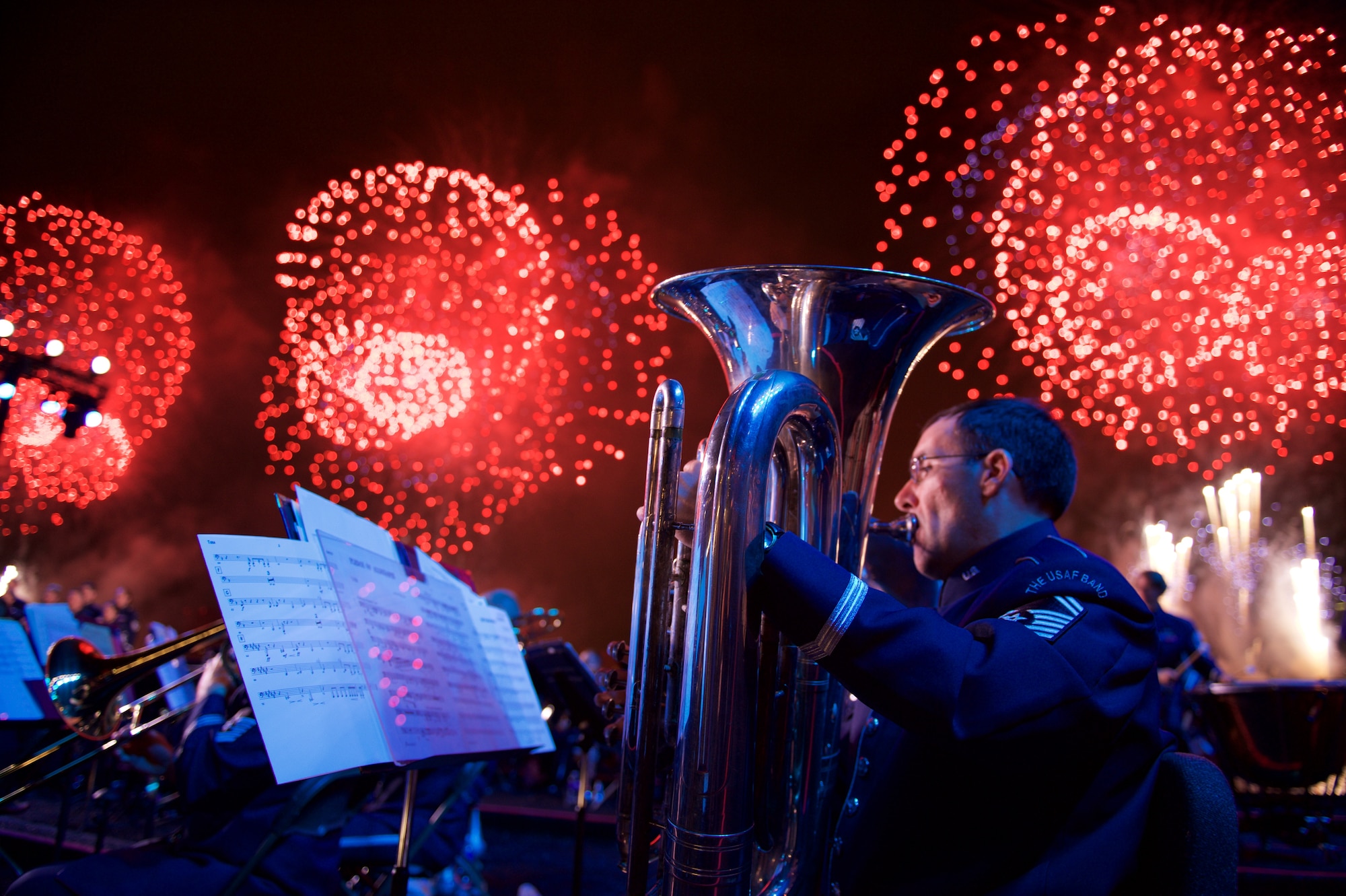 Senior Master Sgt. Brian Sands performs during the 2015 Macy's fireworks celebration in Hunter's Point South Park in Long Island on the Fourth of July.  The Ceremonial Brass, Concert Band, Singing Sergeants and Strolling Strings combined forces to execute the largest mobilization in the units history. (U.S. Air Force photo by Senior Master Sgt. Bob Kamholz/released) 

