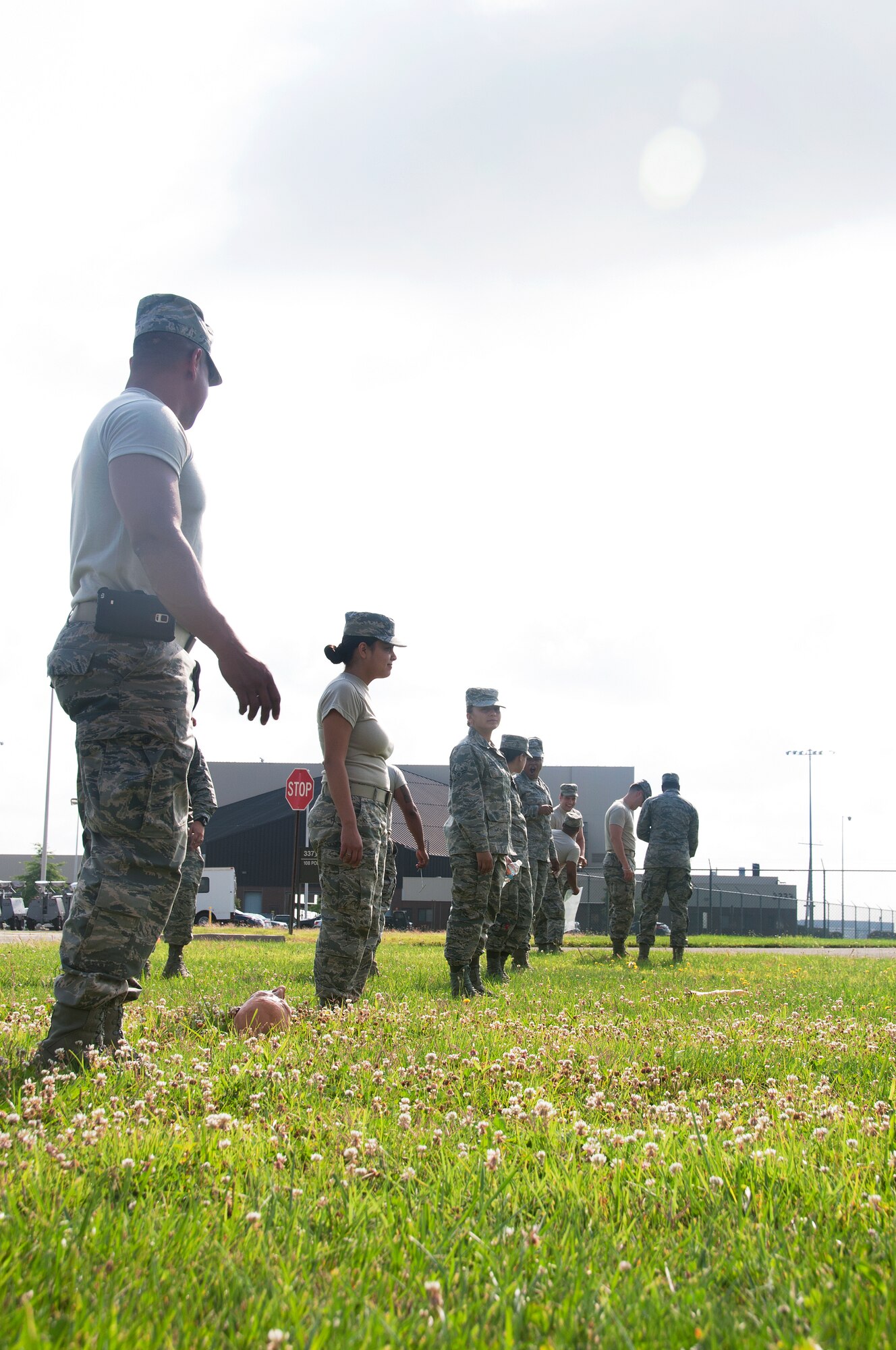 108th Force Support Squadron Airmen line up to perform a search and recovery exercise during the unit's annual home-station training at Joint Base McGuire-Dix-Lakehurst, N.J., July 7, 2015. The training helped prepare Airmen to search and recover scattered remains over an area if a disaster took place, such as a plane crash. (U.S. Air National Guard photo by Airman 1st Class Julia Pyun/Released)