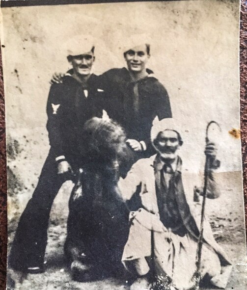 Joseph Hartz (right) and a Navy buddy pose in an Oct. 9, 1944, photo found in the wallet returned to Hartz’s son, Nick Merrill, and his daughter, Patti Speranzi, still living in Spokane, Wash., by Kelsey Nearing, Spokane resident, Staff Sgt. Rich Johnson, a 92nd Air Refueling Squadron boom operator, and Jim O’Connell, 92nd Air Refueling Wing historian, at Fairchild Air Force Base, Wash. Rummaging through donations, Nearing found the wallet while volunteering at the Rocky Cove Youth Ranch in Tum Tum, Wash. (Courtesy photo) 