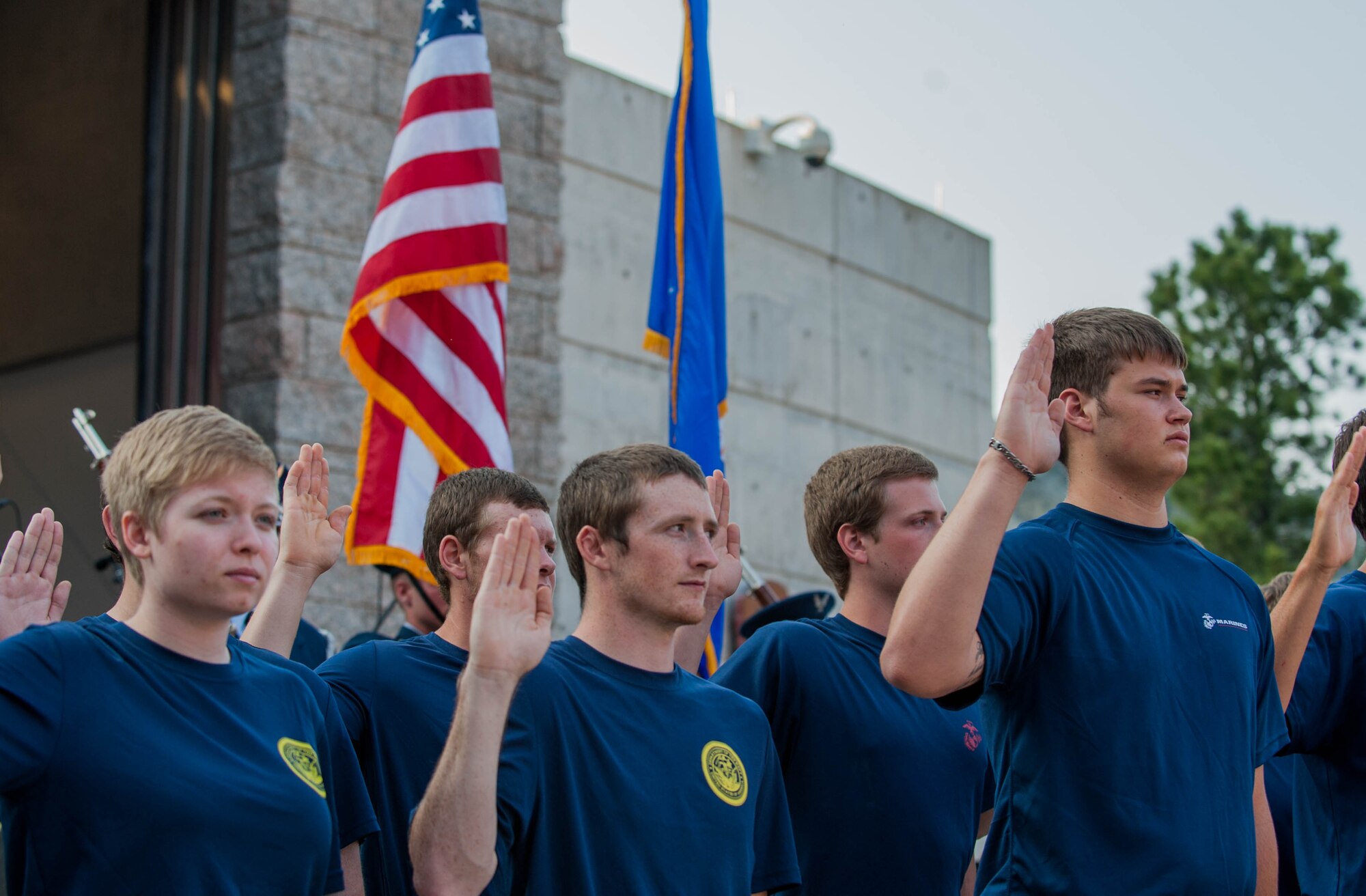 U.S. military recruits from the U.S. Navy and Marine Corps prepare to swear the oath of enlistment during a special enlistment ceremony at Mount Rushmore National Memorial in South Dakota, July 3, 2015. Col. Gentry Boswell, 28th Bomb Wing commander, administered the oath, which all servicemembers must make to support and defend the Constitution of the United States. (U.S. Air Force photo by 1st Lt. Rachel Allison/Released)