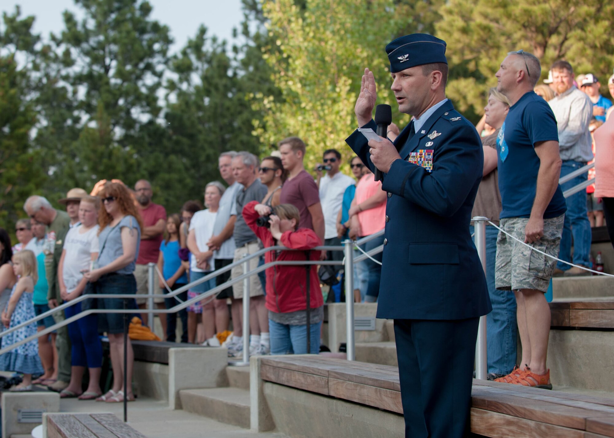 Col. Gentry Boswell, 28th Bomb Wing commander, administers the oath of enlistment to U.S. military recruits during an enlistment ceremony at the Mount Rushmore National Memorial in South Dakota, July 3, 2015.  More than 30 men and women enlisted into the U.S. Air Force, Navy, and Marine Corps as part of several special events done as part of the Independence Day festivities. (U.S. Air Force photo by 1st Lt. Rachel Allison/Released)