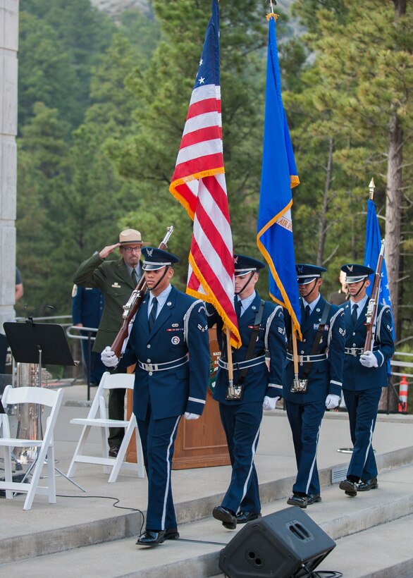 Members of the Ellsworth Air Force Base Honor Guard prepare to present the colors before an enlistment ceremony at the Mount Rushmore National Memorial in South Dakota, July 3, 2015. The Honor Guard performed a series of ceremonies as part of an Independence Day program in the park’s amphitheater,  including the presentation of the colors, a POW/MIA Remembrance ceremony, retreat and a flag-folding ceremony. (U.S. Air Force photo by 1st Lt. Rachel Allison/Released)