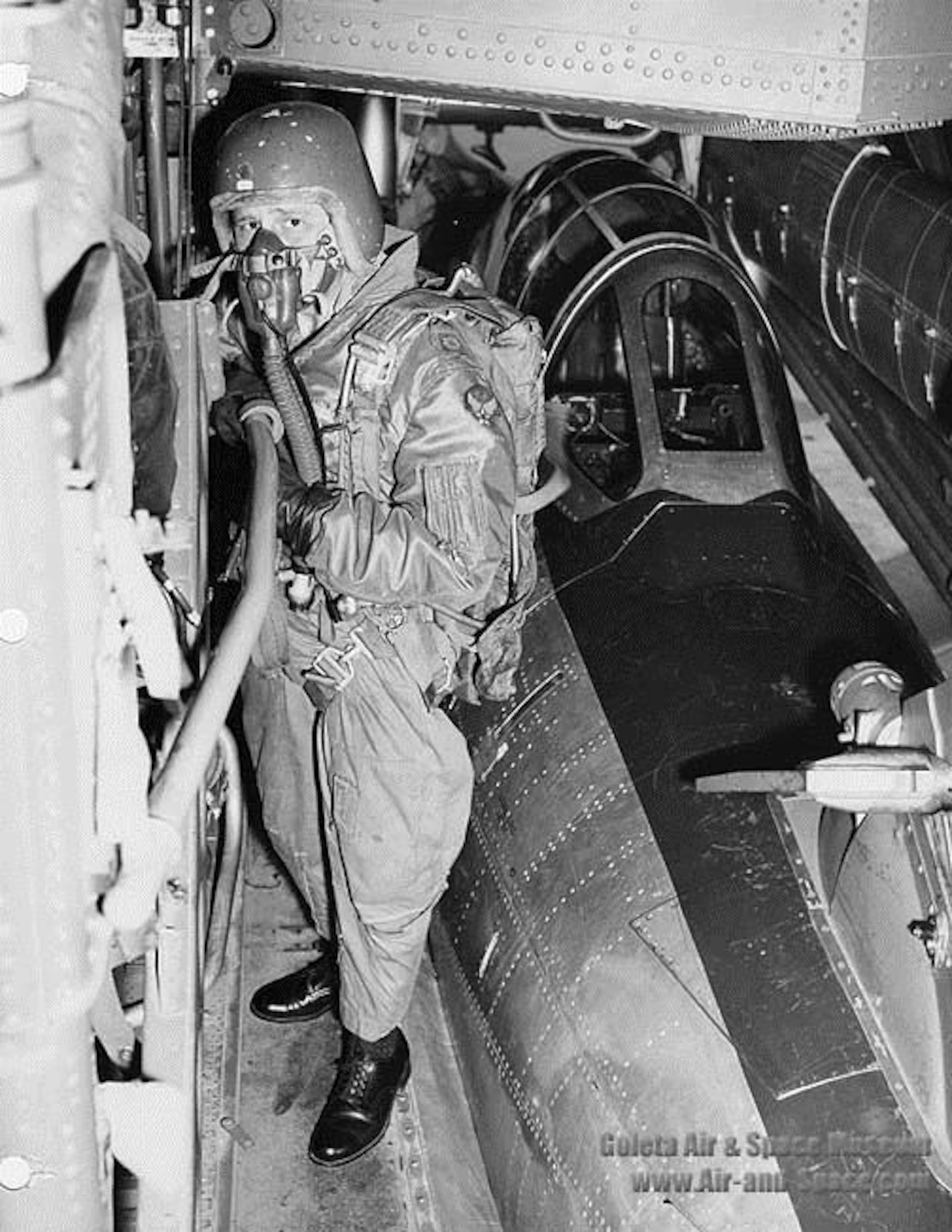 Maj. Clyde Good, FICON test pilot, working his way from the cockpit of the YRF-84F Thunderflash to the camera compartment. The final FICON evaluation flight of the YRF-84F was flown on June 9, 1954. (U.S. Air Force photo)