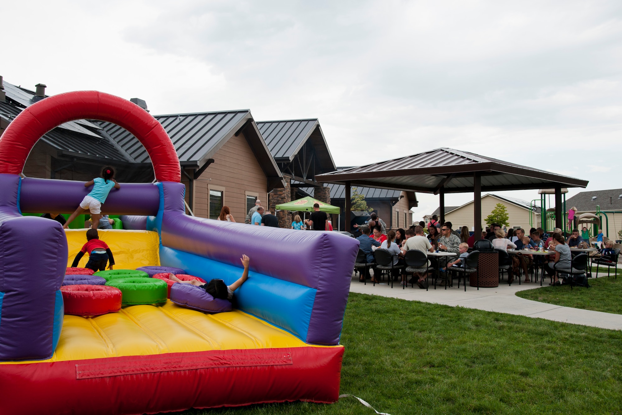 PETERSON AIR FORCE BASE, Colo. – The Chapel kicked off the July Fourth weekend with a community cook off for Team Pete members and their families at the Tierra Vista community center, July 2, 2015. The Chapel provided hot dogs, hamburgers, sides, games and bounce castles for approximately 200 people. (U.S. Air Force photo by Senior Airman Tiffany DeNault)