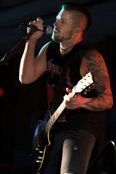 Ryan Ray entertains U.S. Air Force Airmen from Sheppard Air Force Base, Texas, during the JC AllStars performance July 3, 2015. The JC AllStars are a non-profit band with a mission to give back to the troops through live entertainment and music education. They also sponsor a grant for troops that wish to pursue music. This image is not official endorsement by the U.S. Air Force. (U.S. Air Force photo by Senior Airman Kyle Gese/Released)