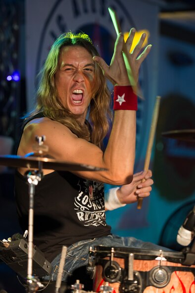 Paul Brown entertains U.S. Air Force Airmen from Sheppard Air Force Base, Texas, during the JC AllStars performance July 3, 2015. The JC AllStars are a non-profit band with a mission to give back to the troops through live entertainment and music education. They also sponsor a grant for troops that wish to pursue music. This image is not official endorsement by the U.S. Air Force. (U.S. Air Force photo by Senior Airman Kyle Gese/Released)