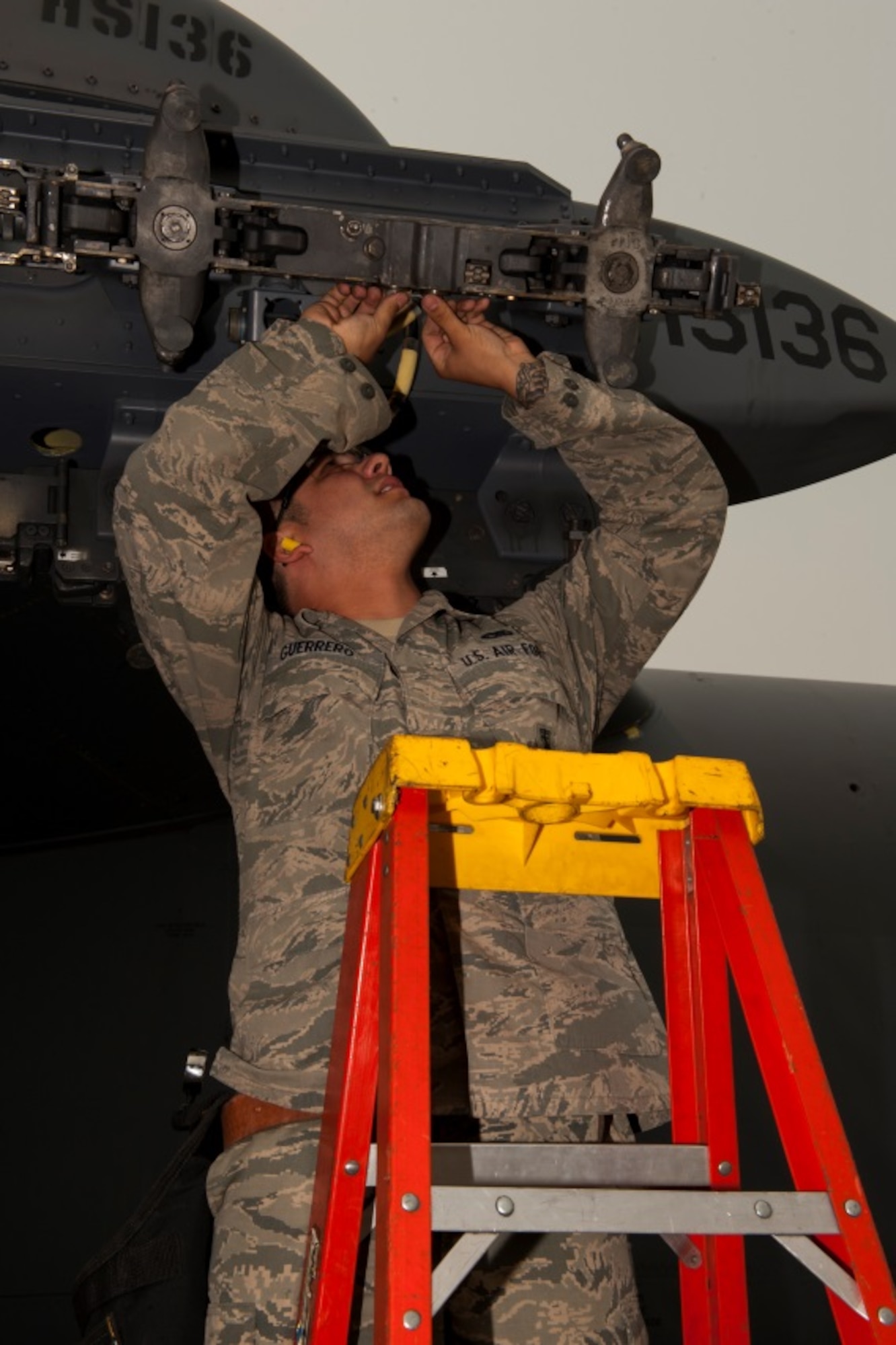 Airmen from the 5th Aircraft Maintenance Squadron load inert AGM-158 missiles onto a B-52H Stratofortress during the Load Crew of the Quarter competition at Minot Air Force Base, N.D., July 1, 2015. The competition is comprised of four parts: dress and appearance, a loader’s knowledge test, toolbox inspection and the timed missile load.  The first of two four-man crews to participate was led by Staff Sgt. Demeterius White, a 5th Maintenance Squadron load crew chief. (U.S. Air Force photos/ Airman 1st Class Christian Sullivan and Airman 1st Class Justin T. Armstrong)