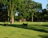 A group of dogs play at the Lincoln Dog Park in Grand Forks, N.D., July 6, 2015. The Lincoln Dog Park is located in the Lincoln Drive Park in Grand Forks. The park offers several forms of free entertainment including disc golf, horseshoes, playgrounds and more. (U.S. Air Force photo by Airman 1st Class Ryan Sparks/released)