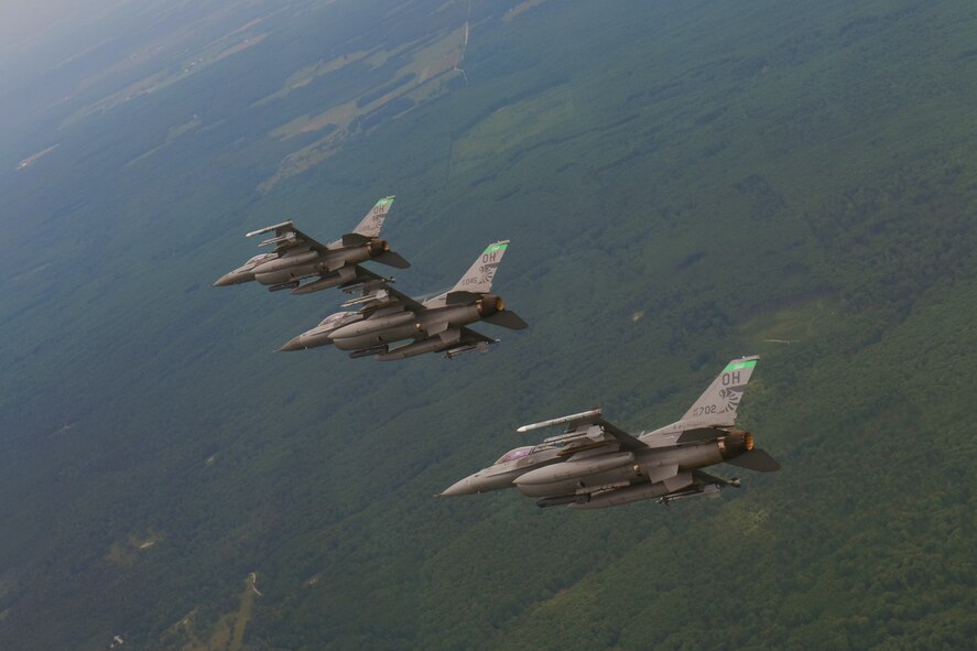 F-16 Fighting Falcons fly over Northwest Ohio and Michigan during a training sortie, June 25, 2015. The 180th Fighter Wing was performing training sorties over the Great Lakes June 21-24. (Air National Guard photo by Tech. Sgt. Amber Williams/Released)