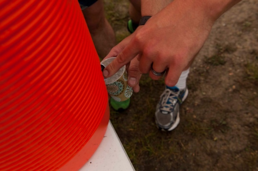 An Airman fills up his water cup after finishing the Firecracker 5K at Minot Air Force Base, N.D., July 2, 2015. The McAdoo Fitness Center holds many 5K’s and special events throughout the year for resiliency and a way to stay healthy. (U.S. Air Force photo/Airman 1st Class Christian Sullivan)