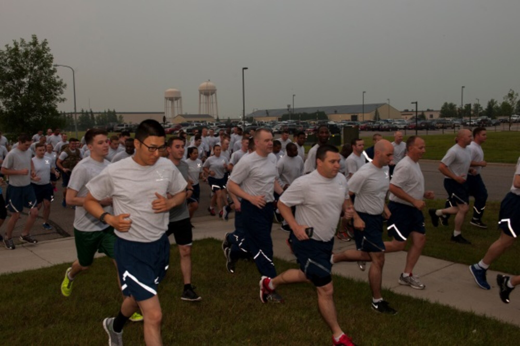 Runners take off as the Firecracker 5K begins at Minot Air Force Base, N.D., July 2, 2015. Runners made a loop around the base for the course of the run. (U.S. Air Force photo/Airman 1st Class Christian Sullivan)
