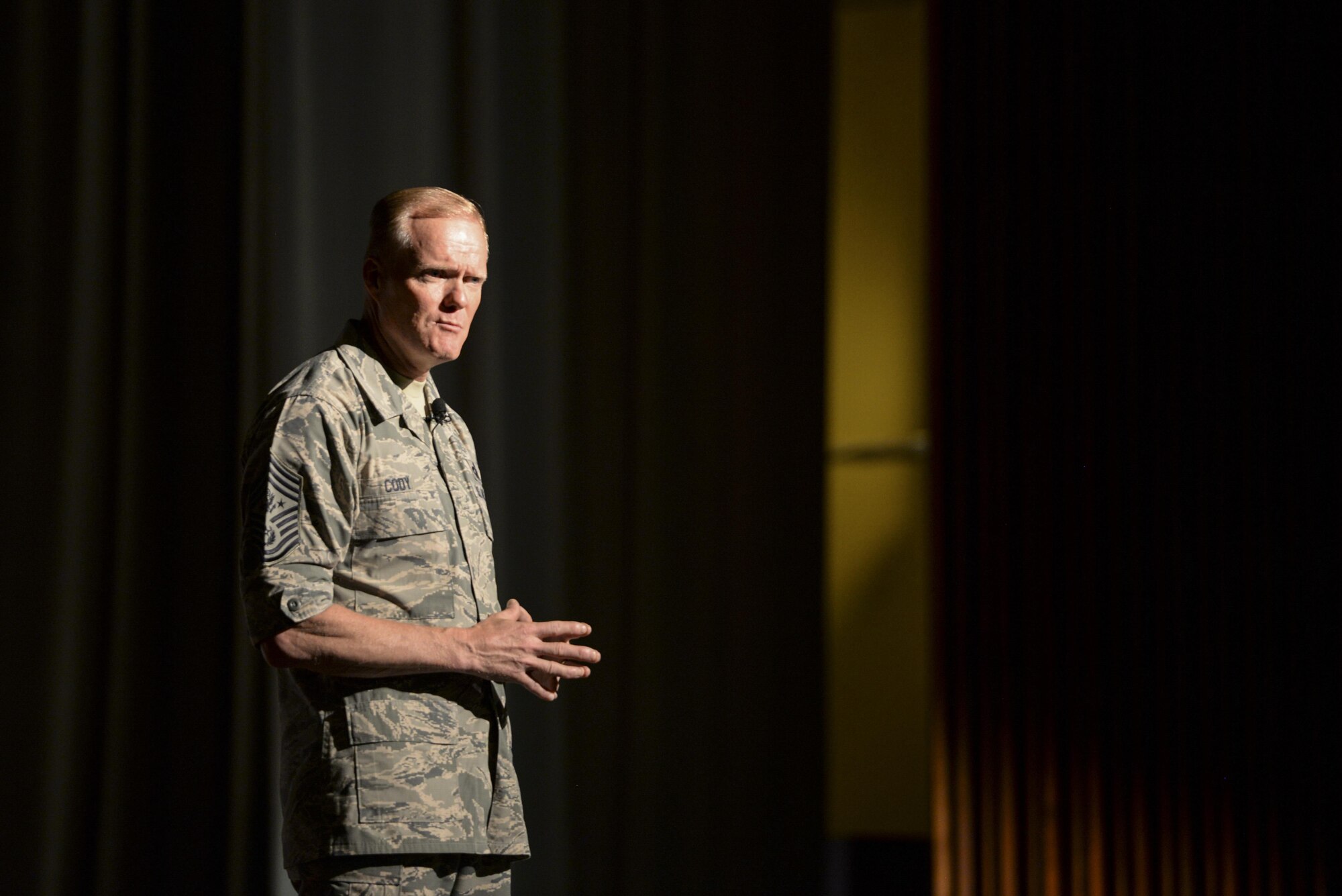 Chief Master Sgt. of the Air Force James Cody speaks to enlisted Airmen at an all-call held in the Keystone Theater of Kadena Air Base, Japan, July 7, 2015. During the all-call, Cody addressed challenges and opportunities facing today’s Airmen such as possible changes to retirement, senior NCO boards and the recent changes to the Enlisted Evaluation System. (U.S. Air Force photo by Senior Airman Omari Bernard)