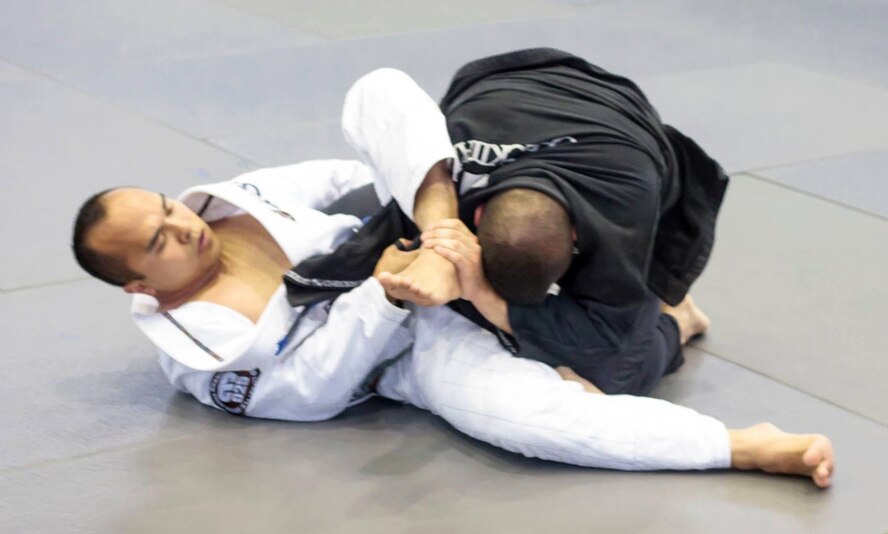 U.S. Air Force Tech. Sgt. Darell Ruda, left, 100th Logistics Readiness Squadron NCO in charge of inspections from White Plains, N.Y., takes part in a Jiu Jitsu competition while deployed in Cyprus Oct. 25, 2014. Ruda took up Judo in 2000 for approximately four years until injuries and deployments lead him to give it up. In 2009 he discovered Jiu Jitsu as an alternative fitness routine. (Courtesy photo/Released)