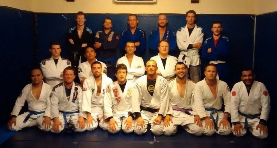 U.S. Air Force Tech. Sgt. Darell Ruda, bottom left, 100th Logistics Readiness Squadron NCO in charge of inspections from White Plains, N.Y., poses for a photograph at the academy in Cambridge, England, where he practices Jiu Jitsu June 18, 2014. Ruda trains as often as he can in his local area and enjoys competing throughout the country. (Courtesy photo/Released) 