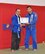 U.S. Air Force Tech. Sgt. Darell Ruda, left, 100th Logistics Readiness Squadron NCO in charge of inspections from White Plains, N.Y., receives his blue belt from David Jay Turner, his trainer, Nov. 9, 2011, in England. Ruda is stationed at RAF Mildenhall, England, and uses his passion for Jiu Jitsu to keep his fitness up. (Courtesy photo/Released)