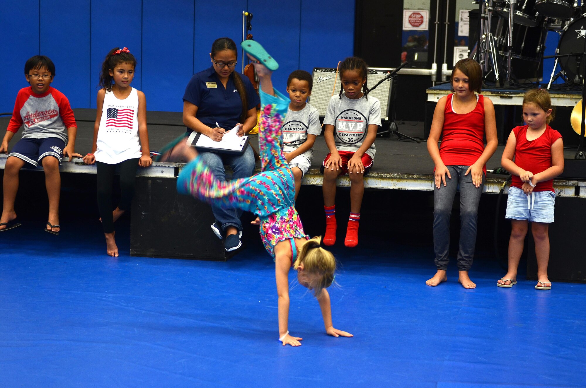 Children participate in a freestyle dance competition at Freedom Fest July 3, 2015, at Andersen Air Force Base, Guam. Freedom Fest 2015 brought approximately 200 Andersen AFB Airmen and their families together to celebrate Independence Day. (U.S. Air Force photo by Airman 1st Class Alexa Ann Henderson/Released)