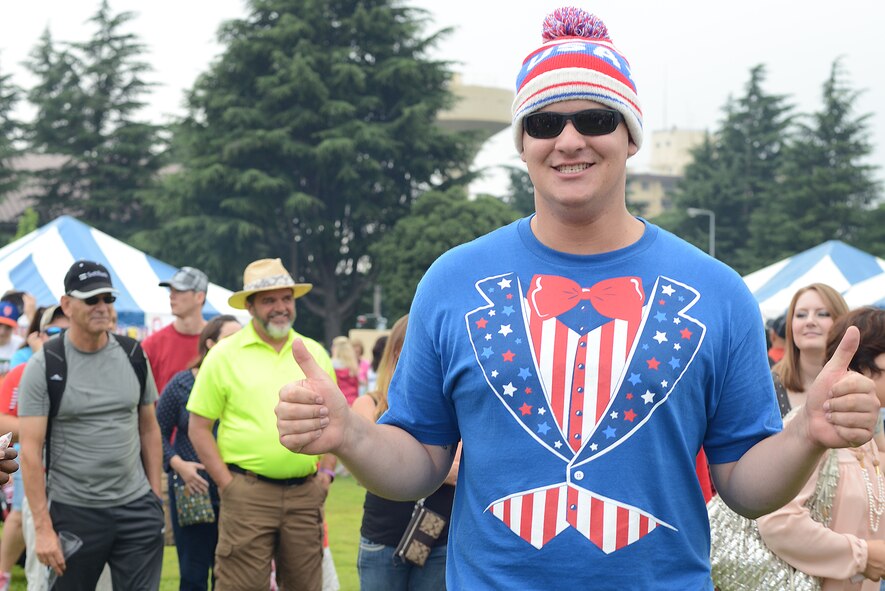 Travis Weaver shows national pride during Celebrate America at Yokota Air Base, Japan, July 2, 2015. The annual event provided military members and their families the opportunity to enjoy games, food and music culminating in a fireworks display over the Yokota airfield to celebrate Independence Day. (U.S. Air Force photo by Airman 1st Class David C. Danford/Released)