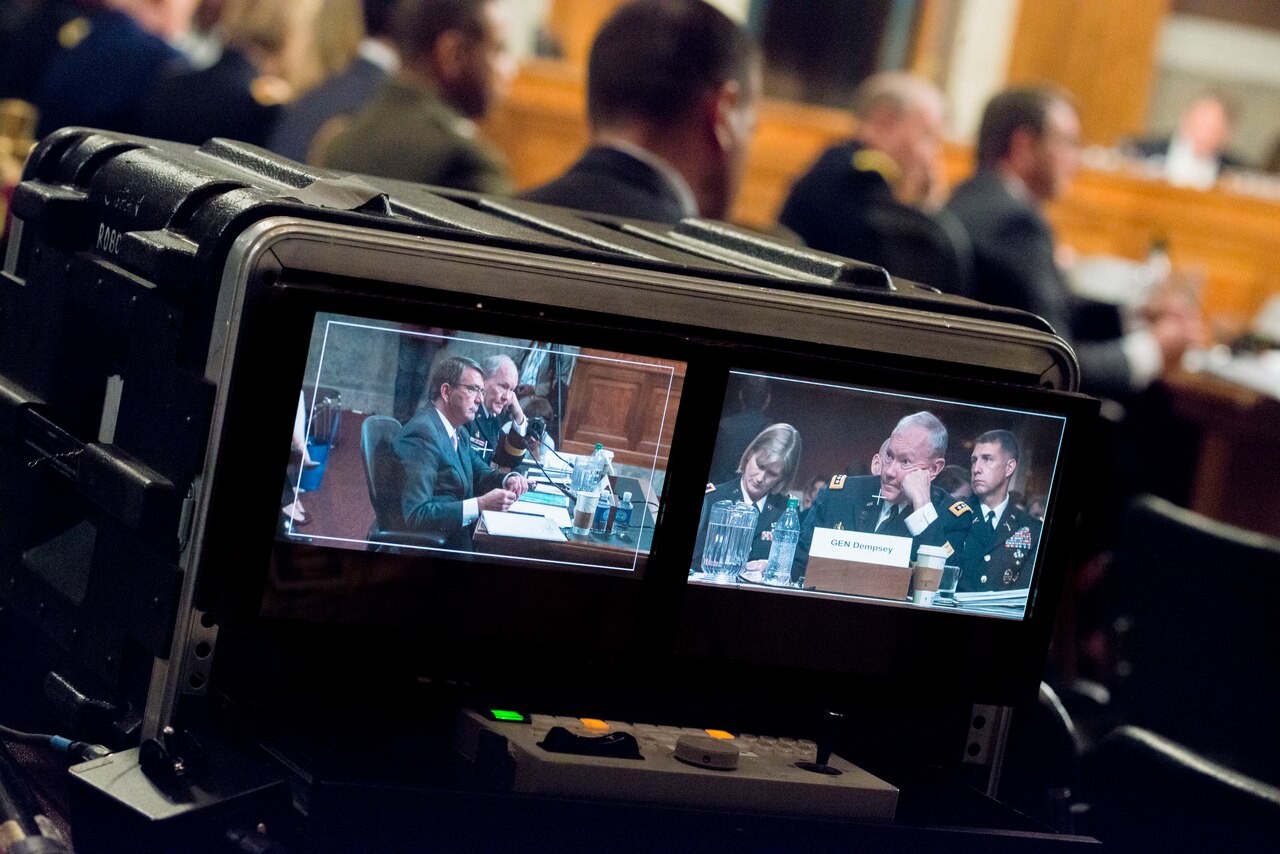 Defense Secretary Ash Carter and Chairman of the Joint Chiefs of Staff Gen. Martin E. Dempsey are shown on video monitors during testimony on the strategy to counter the Islamic State of Iraq and the Levant terrorist organization before the U.S. Senate Committee on Armed Services committee, on Capitol Hill in Washington, July 7, 2015. DoD photo by Army Staff Sgt. Sean K. Harp