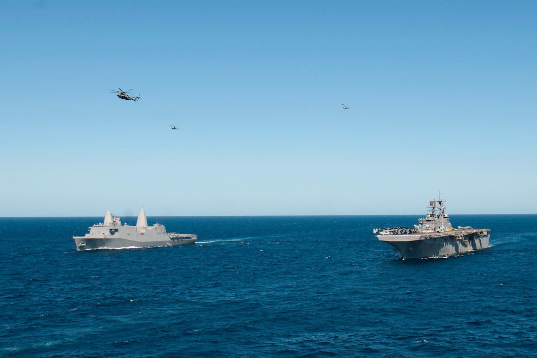 The amphibious assault ship USS Bonhomme Richard, right, sails alongside the amphibious dock landing ship USS Green Bay in the Indian Ocean, July 3, 2015. The Bonhomme Richard is the lead ship of the Bonhomme Richard Expeditionary Strike Group and is on patrol in the U.S. 7th Fleet area of operations.