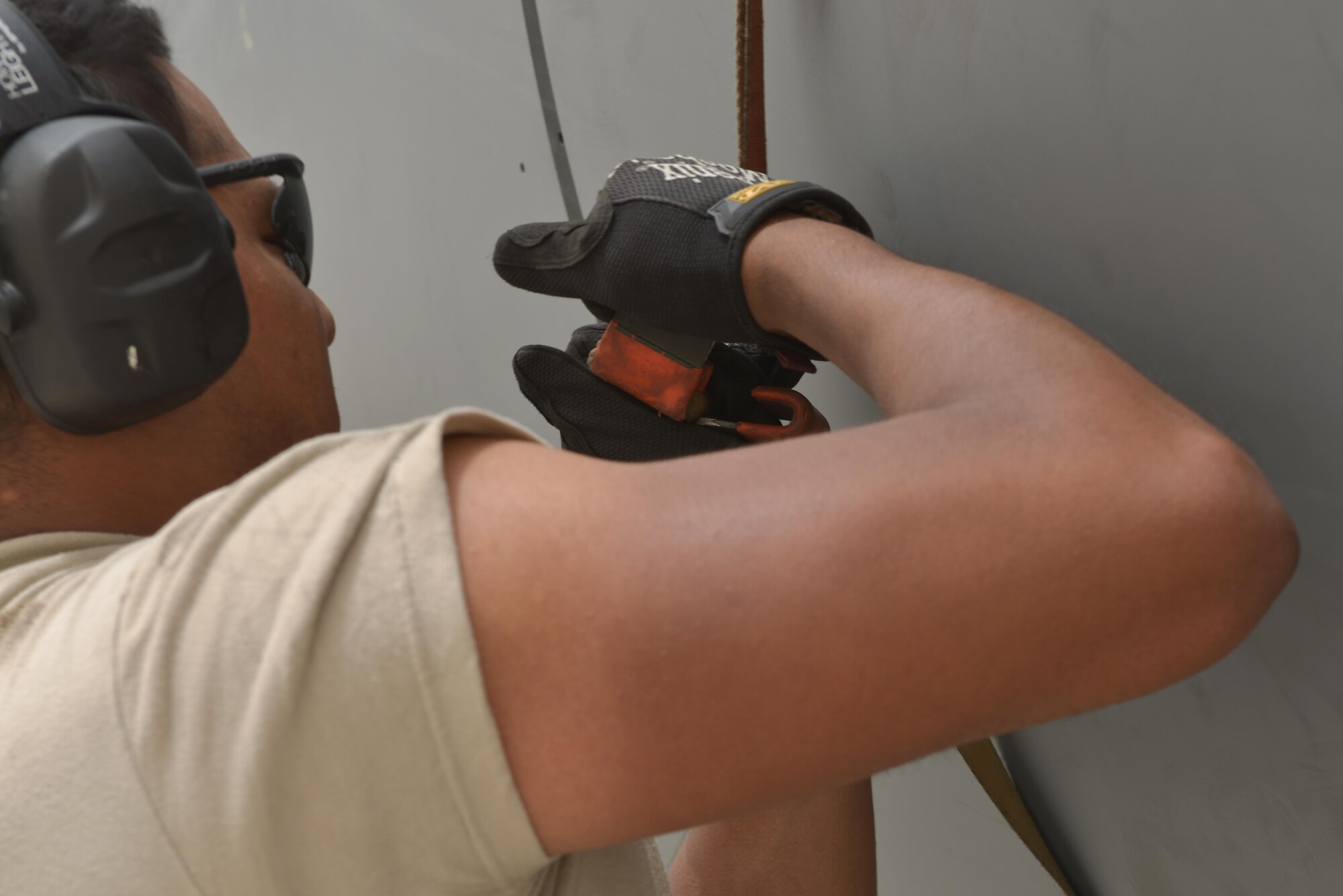 Airman 1st Class Jonathan Palacios-Conde, 340th Expeditionary Aircraft Maintenance Unit, snaps together a locking device on a KC-135 Stratotanker engine cover during pos-flight inspections June 7, 2015 Al Udeid Air Base, Qatar.   