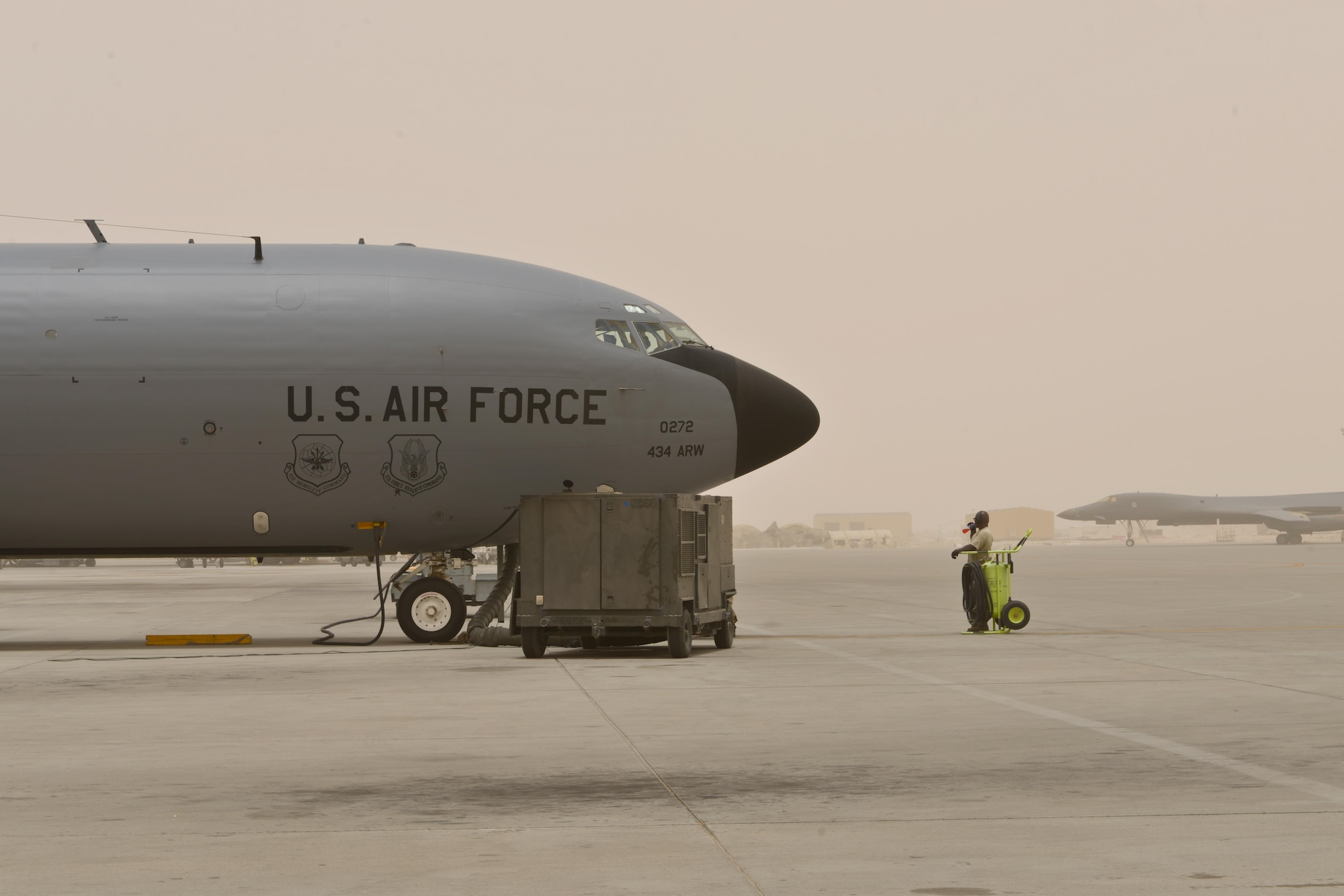 Technical Sgt. Ellison Cason, 340th Expeditionary Aircraft Maintenance Unit, hydrates while the aircrew aboard a KC-135 Stratotanker completes their function checks June 7, 2015 Al Udeid Air Base, Qatar.