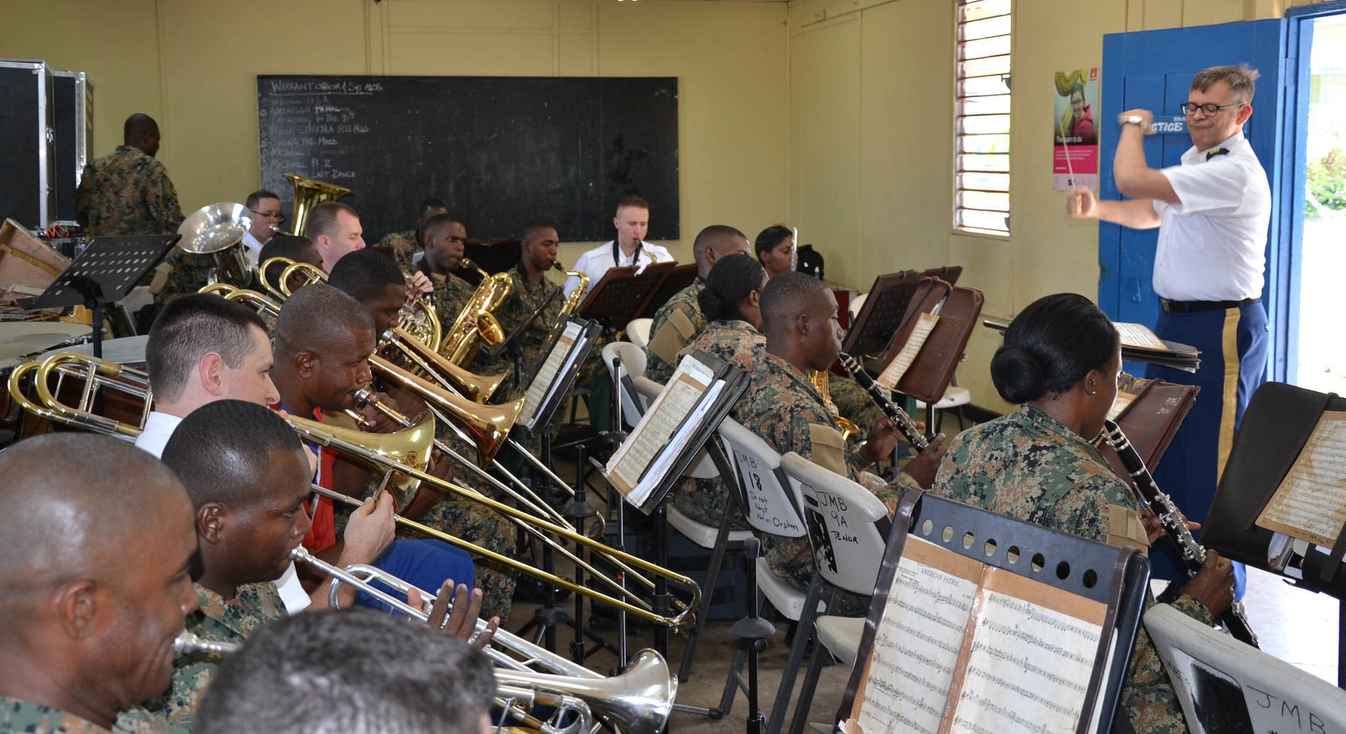 Members of the 257th Army Band and the Jamaica Military Band prepare for concert during State Partnership Program visit July 1. The National Guard State Partnership Program which provides unique partnership-building opportunities between U.S. states, territories and the District of Columbia and foreign countries.