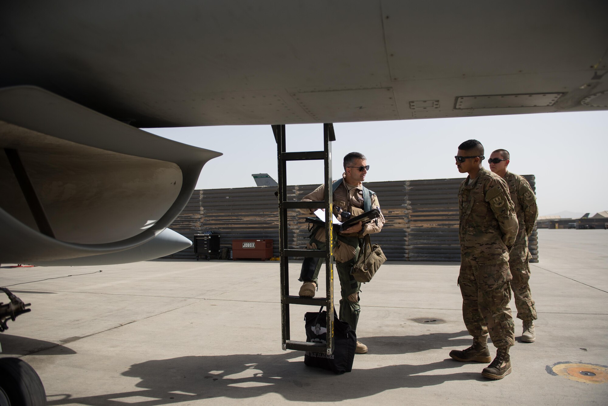 U.S. Air Force Brig. Gen. Dave Julazadeh, 455th Air Expeditionary Wing commander, and Airman 1st Class Manuel Jimenez, 455th Expeditionary Aircraft Maintenance Squadron crew chief, go over F-16 Fighting Falcon aircraft preflight procedures at Bagram Airfield, Afghanistan, July 7, 2015. Julazadeh was flying his first combat sortie as commander of the 455th AEW. (U.S. Air Force photo by Tech. Sgt. Joseph Swafford/Released)