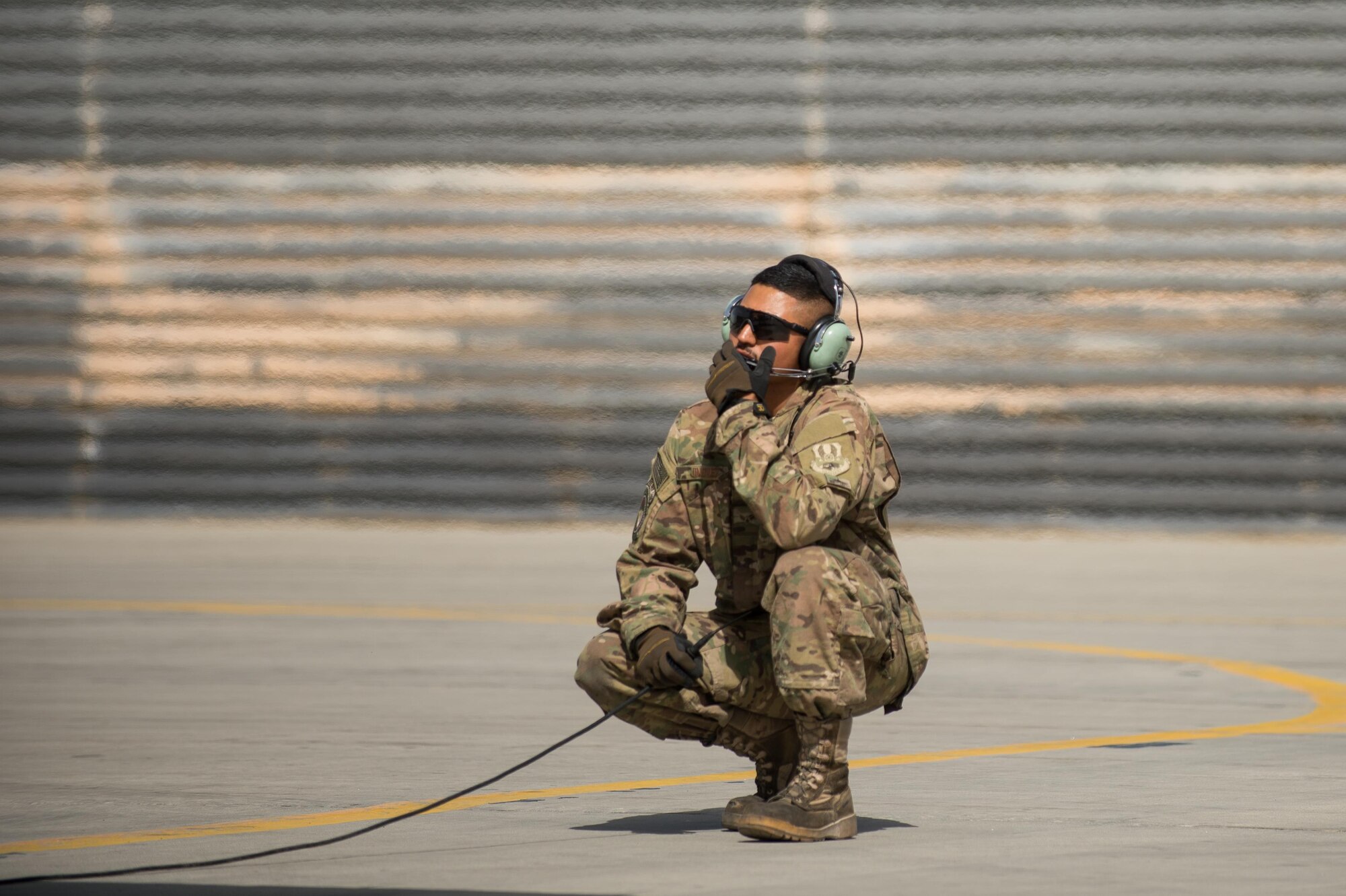 U.S. Air Force Airman 1st Class Manuel Jimenez, 455th Expeditionary Aircraft Maintenance Squadron crew chief, performs a preflight inspection on an F-16 Fighting Falcon aircraft at Bagram Airfield, Afghanistan, July 7, 2015. The F-16 is a multi-role fighter aircraft that is highly maneuverable and has proven itself in air-to-air and air-to-ground combat. (U.S. Air Force photo by Tech. Sgt. Joseph Swafford/Released)