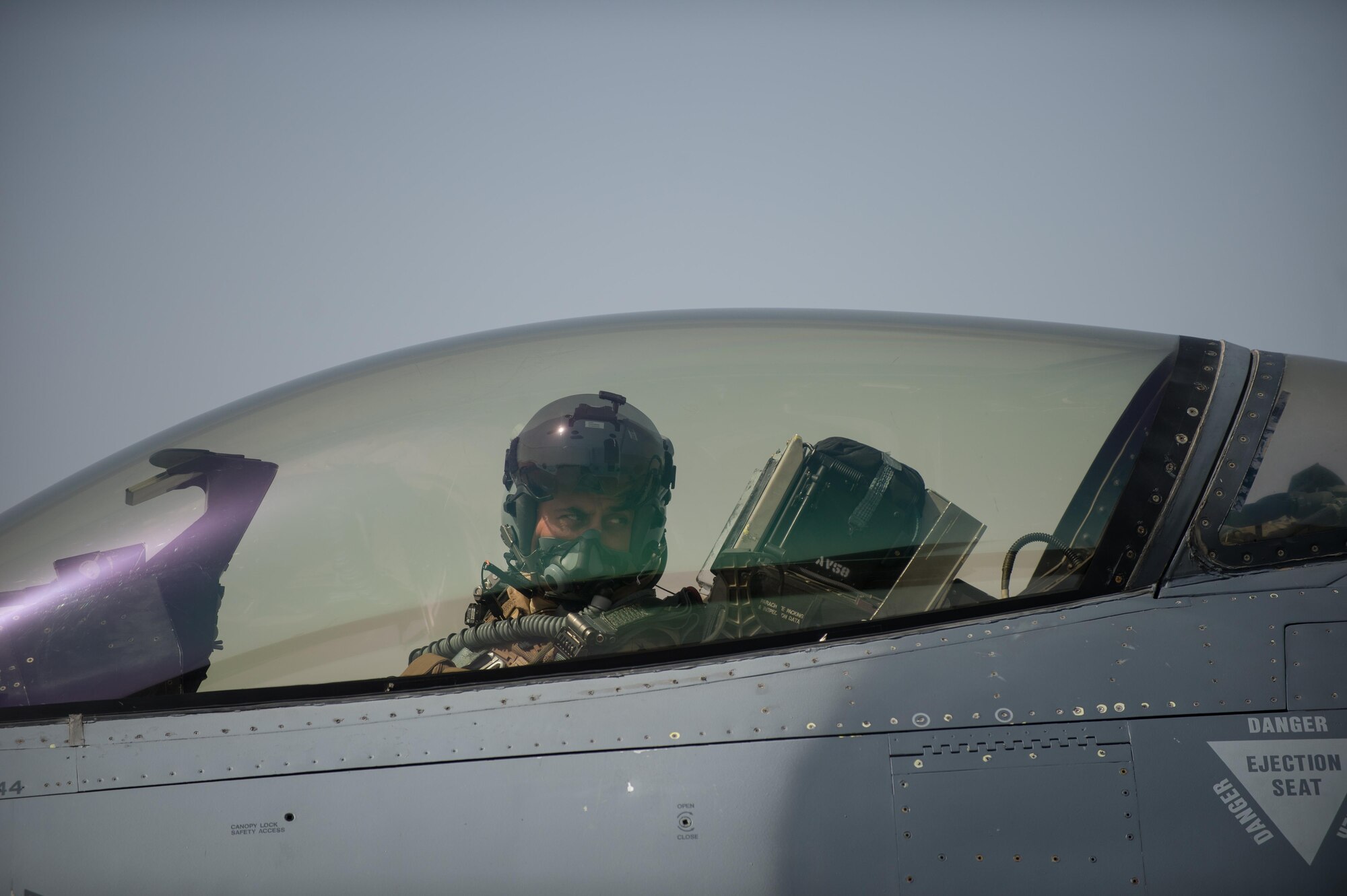 U.S. Air Force Brig. Gen. Dave Julazadeh, 455th Air Expeditionary Wing commander, goes over preflight checks in an F-16 Fighting Falcon aircraft before flying a combat sortie July 7, 2015, at Bagram Airfield, Afghanistan. Julazadeh was flying his first combat sortie as Commander of the 455th AEW. (U.S. Air Force photo by Tech. Sgt. Joseph Swafford/Released)