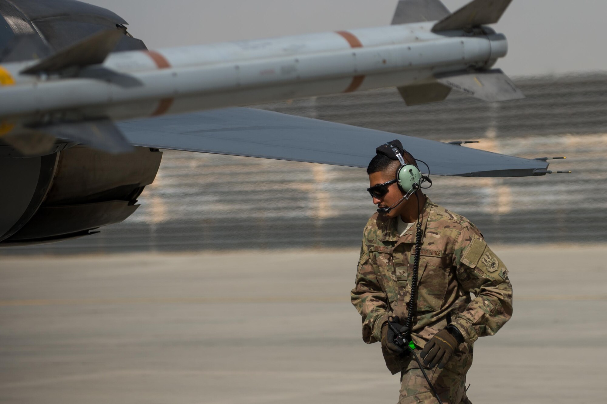 U.S. Air Force Airman 1st Class Manuel Jimenez, 455th Expeditionary Aircraft Maintenance Squadron crew chief, performs a preflight inspection on an F-16 Fighting Falcon aircraft at Bagram Airfield, Afghanistan, July 7, 2015. The F-16 is a multi-role fighter aircraft that is highly maneuverable and has proven itself in air-to-air and air-to-ground combat. (U.S. Air Force photo by Tech. Sgt. Joseph Swafford/Released)