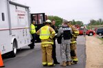 Lt. Col. Timothy Covington, commander of the Wisconsin National Guard's 54th Civil Support Team, coordinates with Jefferson County fire department and Sheriff's Department members during a scenario Saturday morning (May 14) to kick off Vigilant Guard 2011. Vigilant Guard is a large-scale disaster response exercise designed to test National Guard capabilities developed since the Sept. 11, 2001 terrorist attacks, and also since Hurricane Katrina in 2005. Vigilant Guard shows how local, state and federal agencies would collaborate in response to a real emergency.