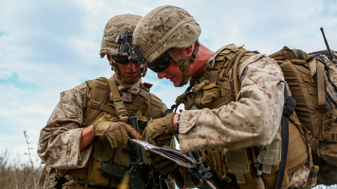 Lance Cpl. Cory Mersino, a fire team leader and Lance Cpl. Chad Conlee, a rifleman, both assigned to Company I, 3rd Battalion, 5th Marine Regiment, navigate during the patrol portion of the 1st Marine Division Super Squad Competition aboard Marine Corps Base Camp Pendleton, Calif., June 30, 2015. The Marines and Sailors tested their abilities to conduct infantry operations for the title of super squad.