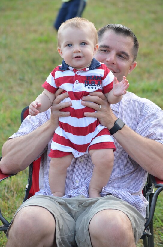Luke, 8 months, enjoys his first Independence Day celebration with his father, Maj. Mike Shull, at Lejeune Field.