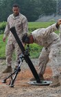 TBS mortar men prepare the mortars for call-for-fire exercise for scout snipers, July 2. The Scout Sniper Instructor School is part of the Weapon’s Training Battalion aboard Marine Corps Base Quantico.