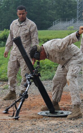 TBS mortar men prepare the mortars for call-for-fire exercise for scout snipers, July 2. The Scout Sniper Instructor School is part of the Weapon’s Training Battalion aboard Marine Corps Base Quantico.