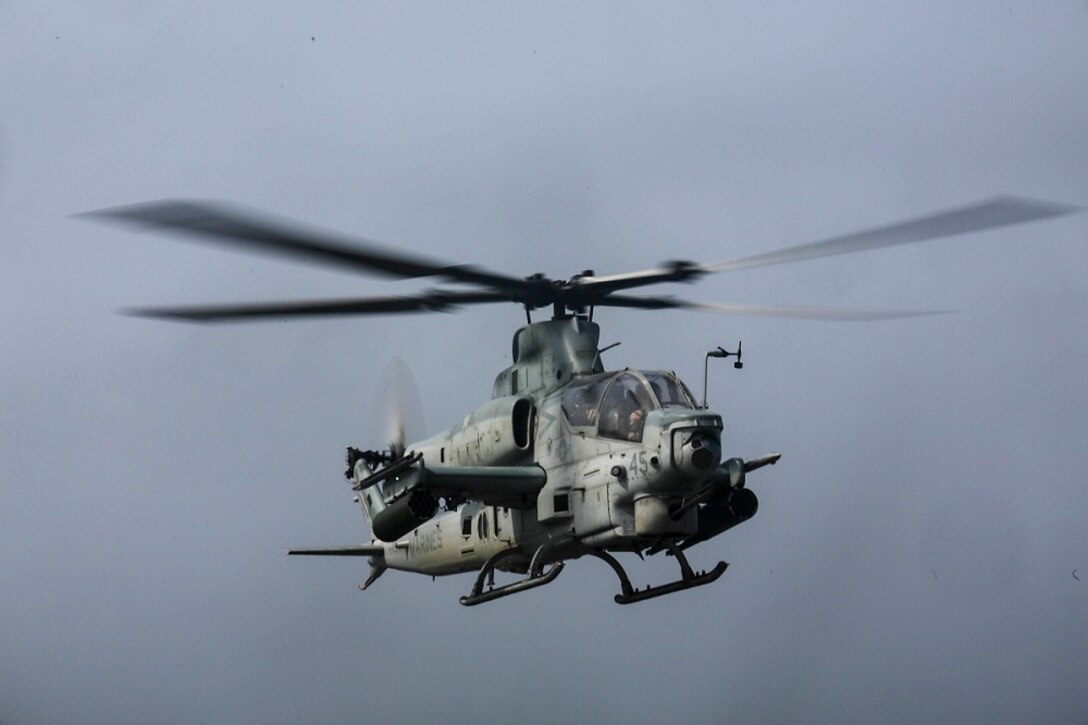 ARABIAN SEA (July 6, 2015) An AH-1Z Viper from the “Greyhawks” of Marine Medium Tiltrotor Squadron 161 (Reinforced), 15th Marine Expeditionary Unit, approaches the amphibious transport dock USS Anchorage (LPD 23).  The “Greyhawks” are the air combat element of the 15th MEU, and embarked aboard the ships of the Essex Amphibious Ready Group, are deployed in support of maritime security operations and theater security cooperation efforts in the U.S. 5th Fleet area of operations. (U.S. Marine Corps photo by Sgt. Jamean Berry/ Released)