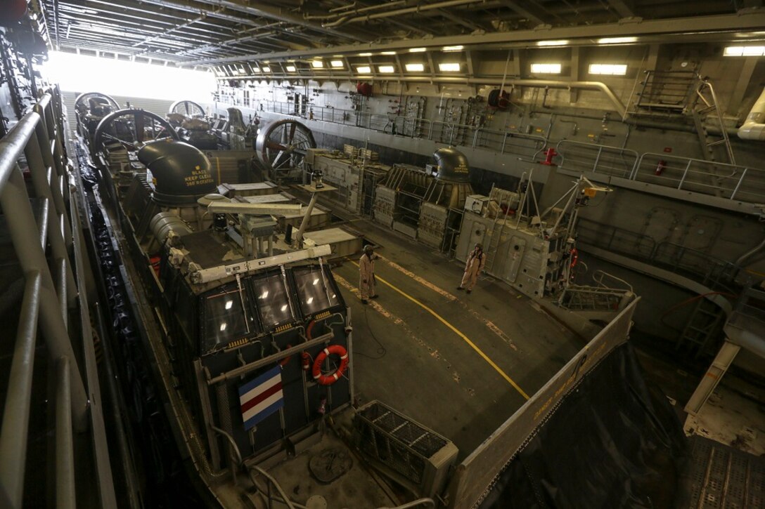 GULF OF ADEN (July 2, 2015) Crewmen prepare to launch a landing craft, air cushion from the well deck of the  amphibious transport dock USS Anchorage (LPD 23).  The Anchorage is part of the Essex Amphibious Ready Group and, with the embarked 15th Marine Expeditionary Unit, is deployed in support of maritime security operations and theater security cooperation efforts in the U.S. 5th Fleet area of operations. (U.S. Marine Corps photo by Sgt. Jamean Berry/Released)